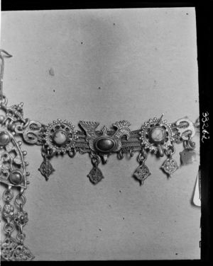 part of jewelled headband showing cock part of jewelled headband showing cock