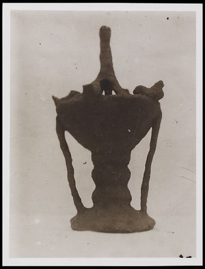 1 bowl on a stand with birds resting on the bowl? 1 bowl on a stand with birds resting on the bowl?