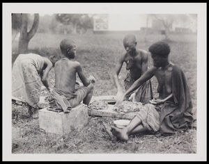 1 4 seated females working clay 1 4 seated females working clay