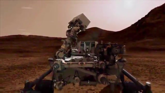 Image of Mars Rover with Martian horizon behind it.